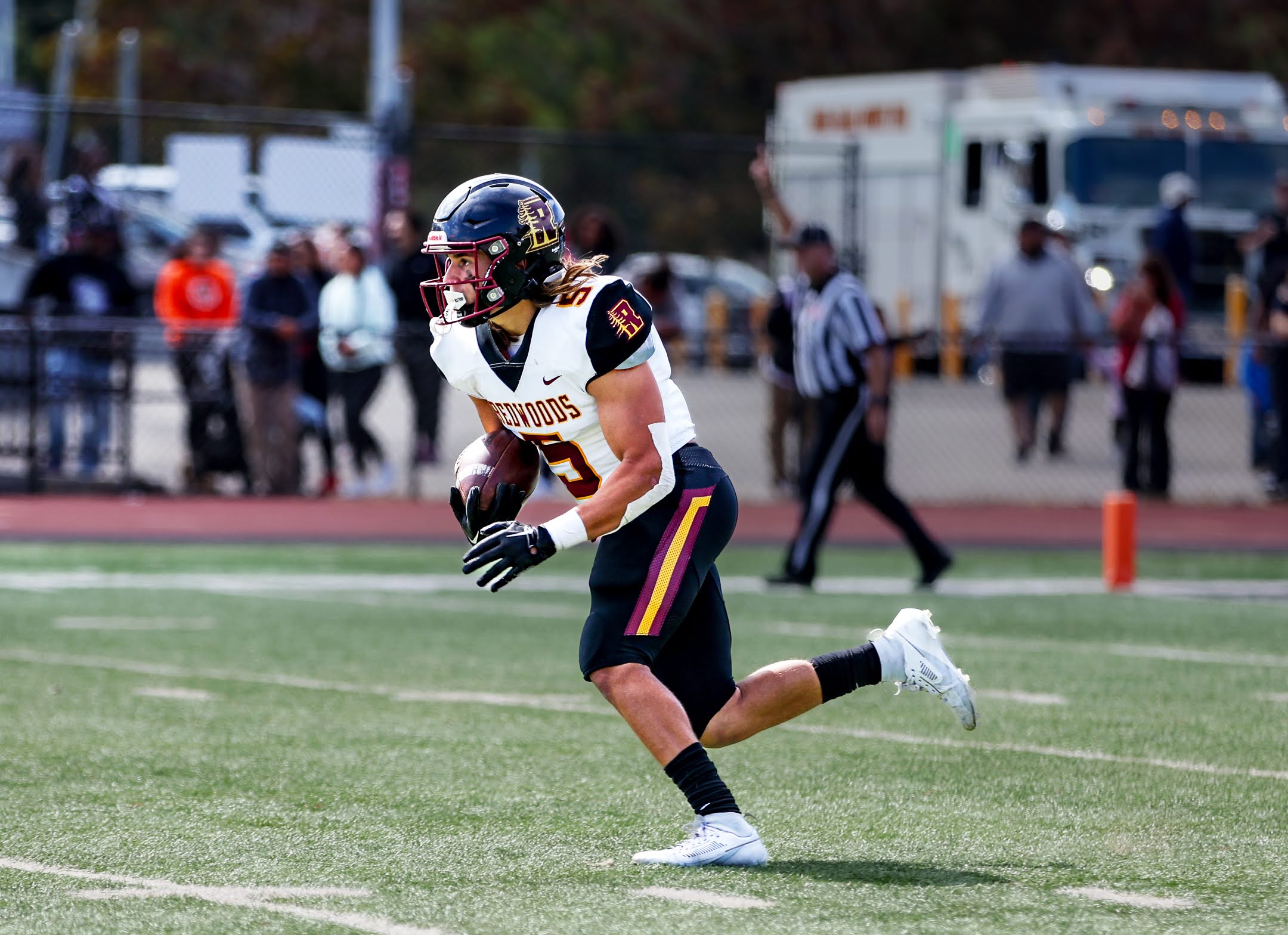 football player f23 runs with the ball
